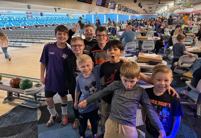 Students posing together at PTO bowling night
