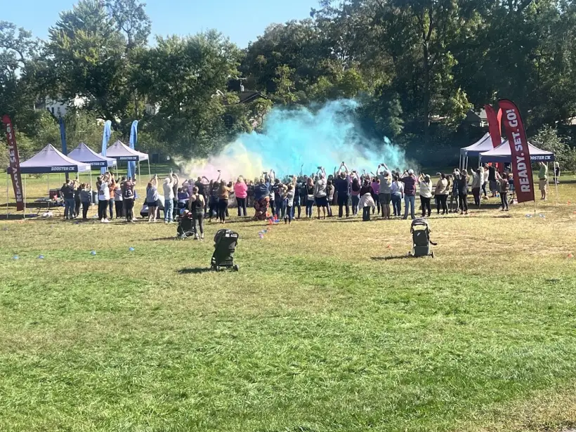 A wide view of the fun run course with colour powder in the air