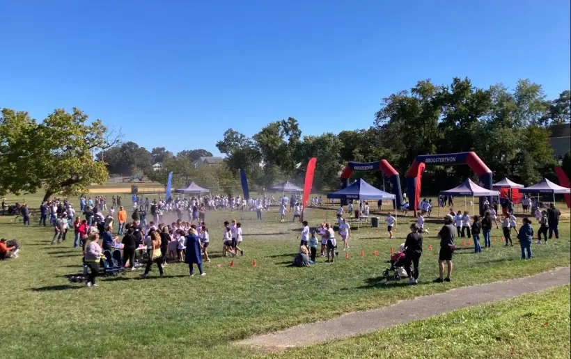Families and students spread across the field on Boosterthon race day