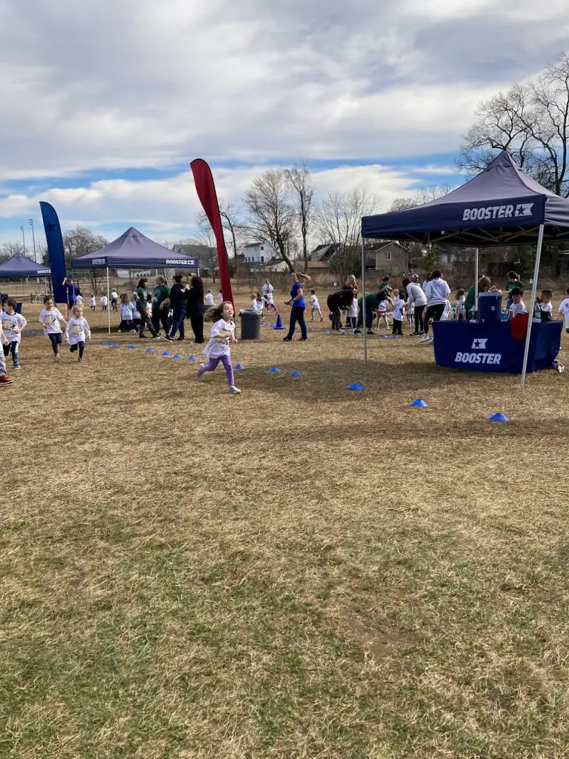 Students gathered on the field before the fun run begins